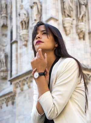 A Vizzetti model poses in Milan, Italy, wearing a Vizzetti watch on her wrist during a photo session.